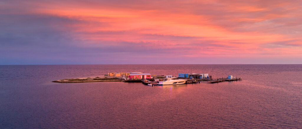 Night falls over Riviera 505 SUV Berry Sweet and the shacks where the Yewers family moored for a week.