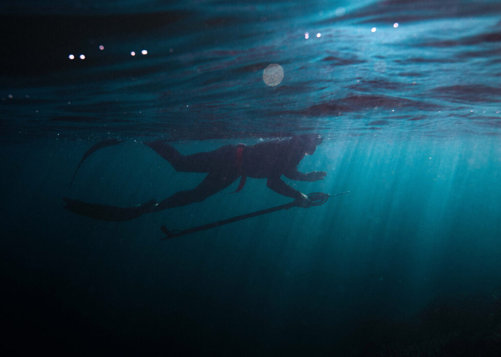 Person under water spare fishing