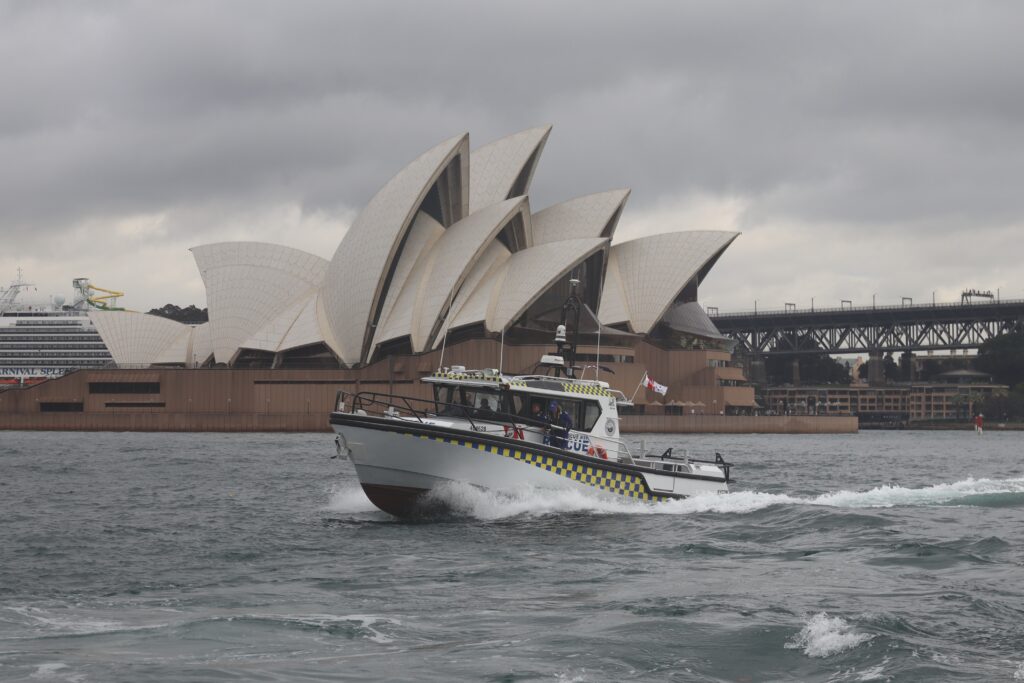 Marine Rescue NSW offshore response vessel with Seakeeper Ride installed on water in front of the Sydney Opera House. 